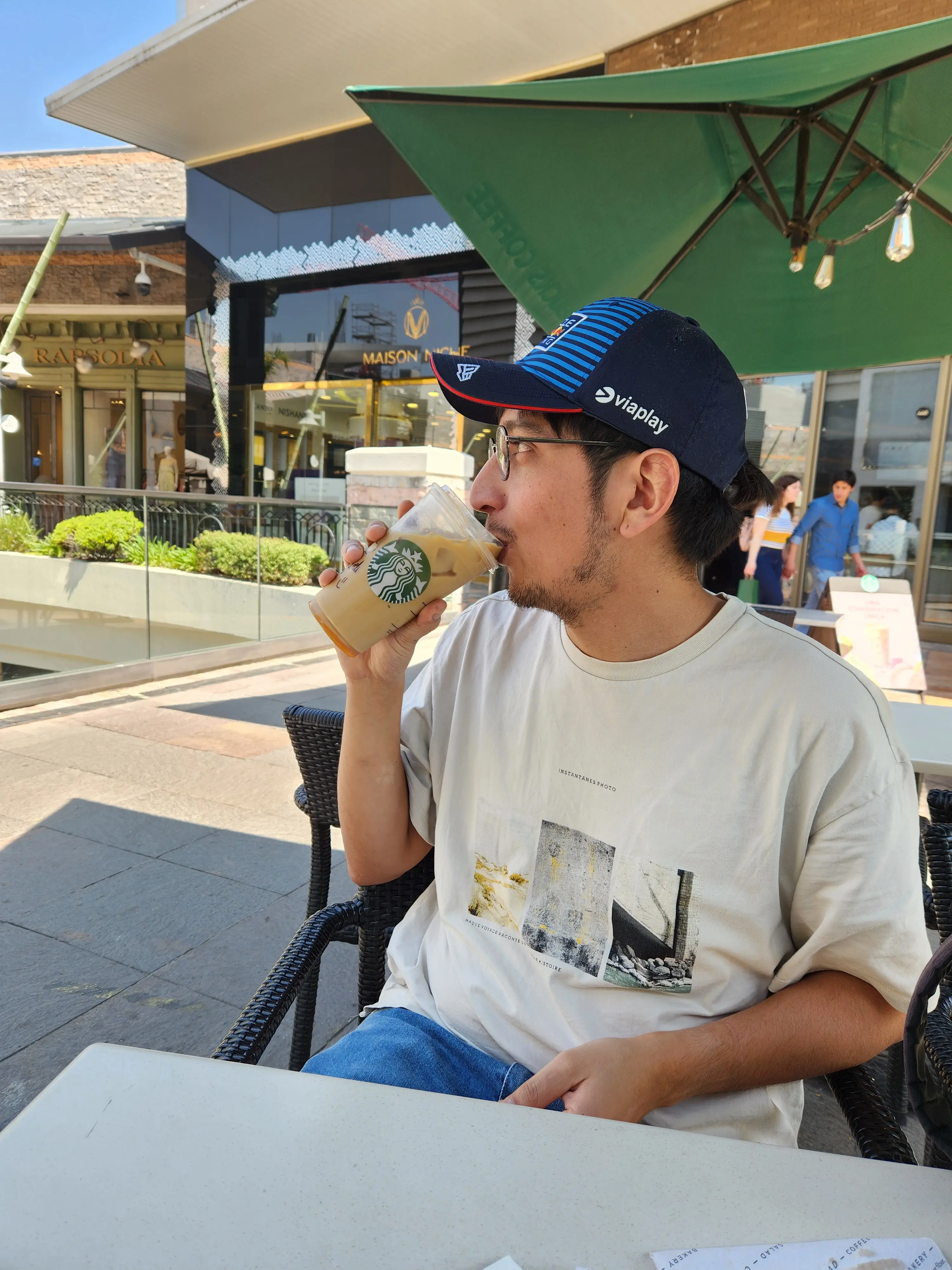 Alvaro Abarca taking a starbucks coffee